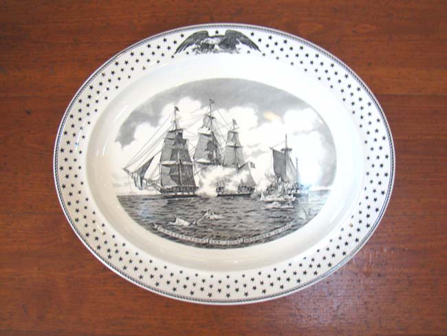 A fine Wedgewood platter commemorating the War of 1812 Naval Battle between the U S S Constitution and the H M S Java